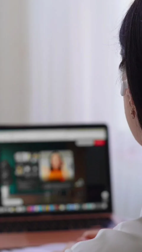 HR manager using laptop for online video call in modern remote work setup Stock Footage 308083758