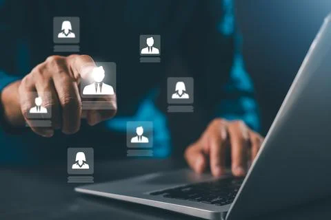 HR manager using stylus on digital candidate profile virtual interface hiri.. Stock Photos