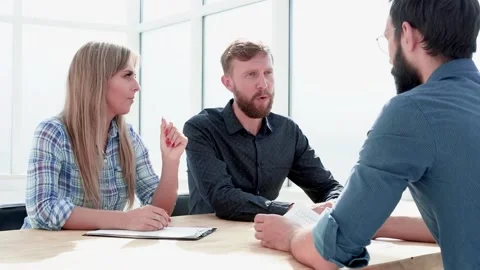 HR managers shaking hands with an applicant during an interview Stock Footage 148156516