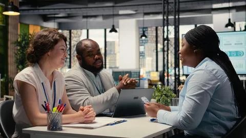 HR team giving ID security card to new hire after the job interview Stock Photos