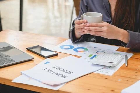 HR workers sit back and relax with coffee on their desks with their compute.. Stock Photos