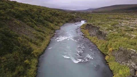 Hraunfossar Waterfall. Lava waterfalls. waterfall flowing down from the lava fie Stock Footage 134602995