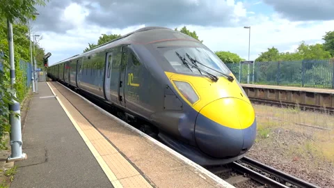 HS1 express train arriving at a station Stock Footage 276572067