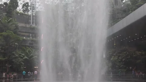 The HSBC Rain Vortex, the world's largest indoor waterfall at 40m tall, in Jewel Stock Footage 304264529
