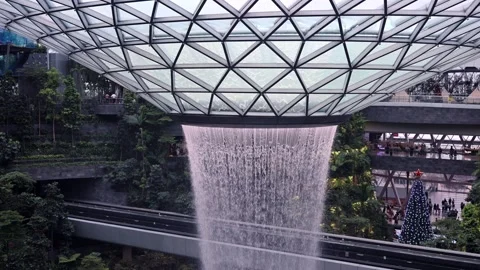 The HSBC Rain Vortex, the world's largest indoor waterfall at 40m tall, in Jewel Stock Footage 304264530