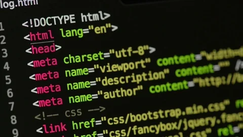 HTML and CSS code developing. Website design code programming on a laptop screen Stock Footage 77649166