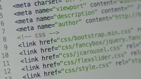 HTML and CSS code developing. Website design code programming on a laptop screen Stock Footage 77649934