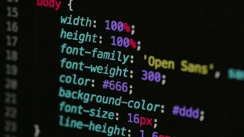 HTML and CSS code developing. Website design code programming on a laptop screen Stock Footage 77650898