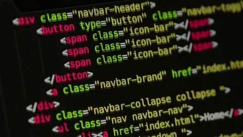 HTML and CSS code developing. Website design code programming on a laptop screen Stock Footage 77650908