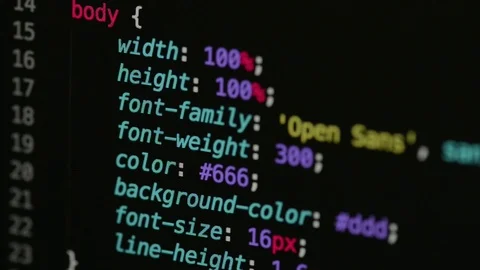 HTML and CSS code developing. Website design code programming on a laptop screen Stock Footage 77651270