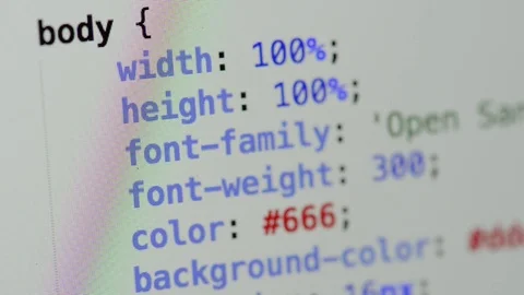 HTML and CSS code developing. Website design code programming on a laptop screen Stock Footage 77652202