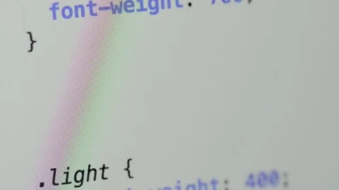 HTML and CSS code developing. Website design code programming on a laptop screen Stock Footage 77652385