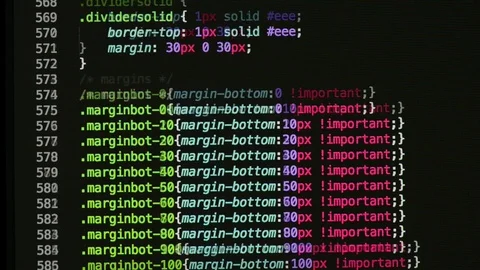 HTML and CSS code developing. Website design code programming on a laptop screen Stock Footage 77654017