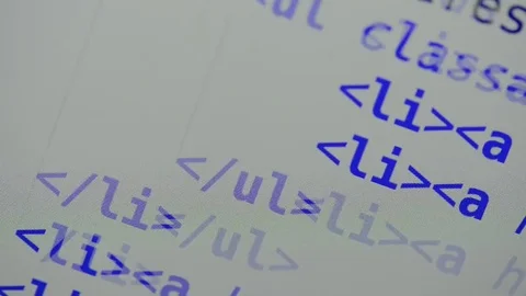 HTML and CSS code developing. Website design code programming on a laptop screen Stock Footage 77662456
