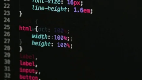 HTML and CSS code developing. Website design code programming on a laptop screen Stock Footage 77729707