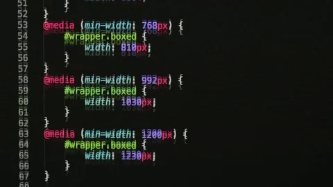 HTML and CSS code developing. Website design code programming on a laptop screen Stock Footage 77729804