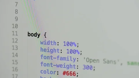 HTML and CSS code developing. Website design code programming on a laptop screen Stock Footage 77729899