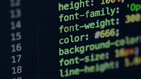HTML and CSS code developing. Website design code programming on a laptop screen Stock Footage 77729967