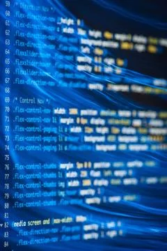 HTML and CSS code developing screenshot with light effects. Stock Photos