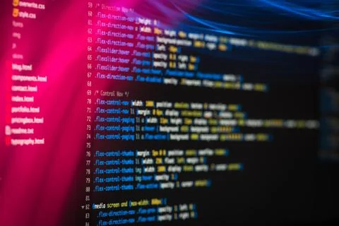 HTML and CSS code developing screenshot with light effects. Stock Photos