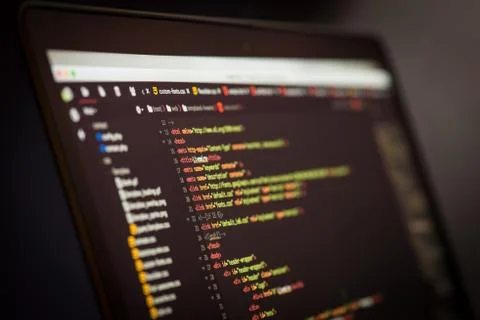 HTML and CSS code developing screenshot. Laptop screen. Stock Photos