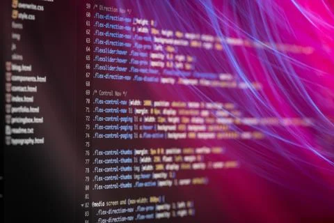 HTML and CSS code developing screenshot with light effects. Stock Photos