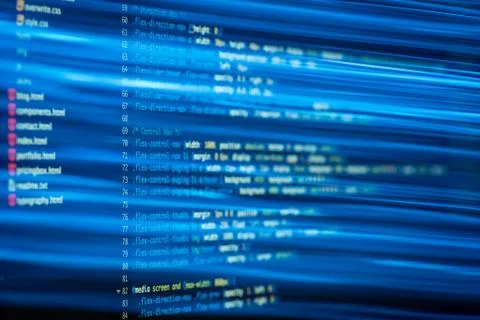 HTML and CSS code developing screenshot with light effects. Stock Photos