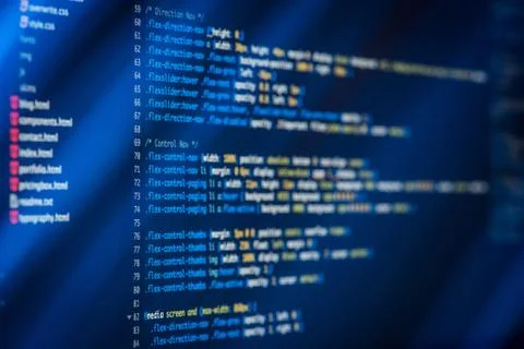 HTML and CSS code developing screenshot with light effects. Stock Photos