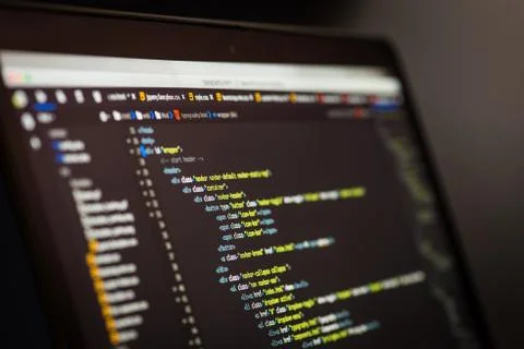 HTML and CSS code developing screenshot. Laptop screen. Stock Photos