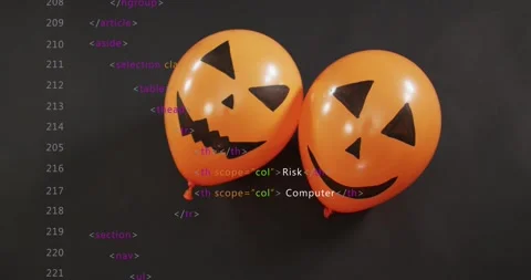 HTML code snippets appearing over jack-o'-lantern balloons, building cyber Stock Footage 317834672