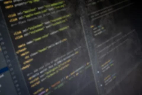 HTML Hello World code on screen blurry background image Stock Photos
