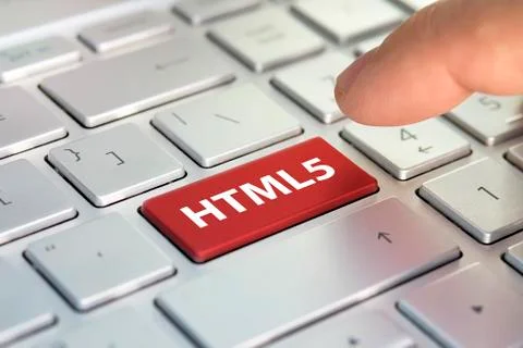 HTML5 computer language. writing on button modern of gray laptop. Finger pres Stock Photos