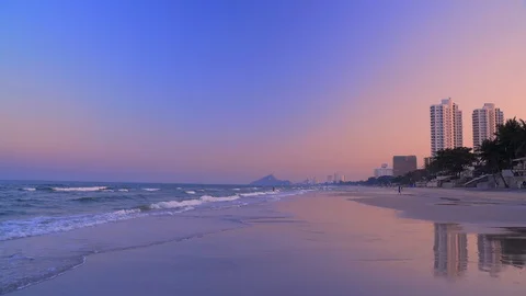 Hua hin beach at sunset. A wide strip of sandy beach and sea waves. Stock Footage