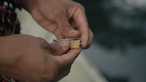 Huaorani preparing a fish Hook Video stock 270460216