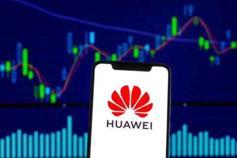 Huawei logo is seen on an android mobile phone over stock chart Stock Photos