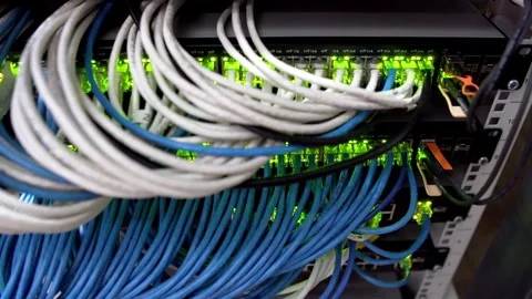 Hub Cable Network Close-up Ethernet Cables Connected to Modem Information and Vídeos de archivo 334586706