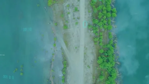 HUD activating, aerial camera pulling back and ascending, revealing spit while Stock Footage 330192169
