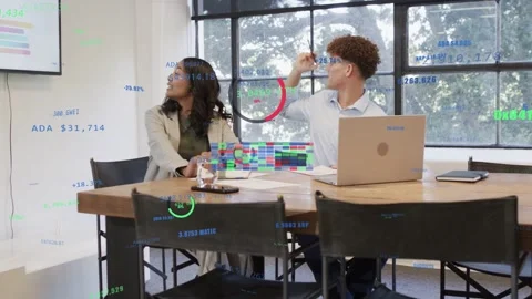 HUD appearing above table, two colleagues reaching with pen, stacking 3D blocks Stock Footage 332900357
