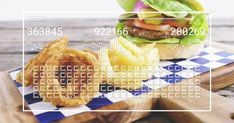 HUD appearing, icons animating over fries, onion rings and burger, camera Stock Footage 323384784