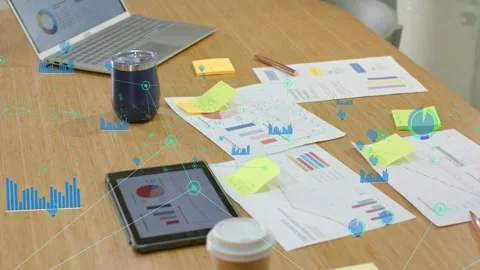 HUD appearing on tabletop, overlays emerging and linking charts as camera Stock Footage 333902365