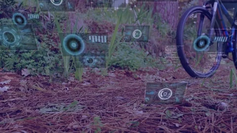 HUD graphics appearing over pine needles, bicycle entering leftward, pedaling, Stock Footage 332504996