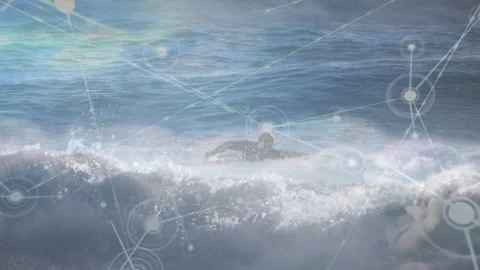 HUD node arising and overlaying scene while male paddling board over surf 動画素材 331756508