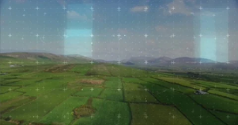 HUD overlay activating and scanning patchwork green fields, panels sliding then Stock Footage 334312217