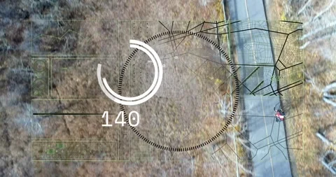 HUD overlay appearing and rotating, tracking bright brush patch while rider Stock Footage 331160860