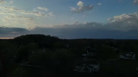 Hudson OH, Stormy-Cloudy Sunset, R2L Pan Rise Stock Footage 191687683