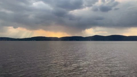 Hudson River New York dramatic sunset behind clouds dusk Stock Footage 153558346
