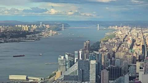 Hudson River with view of Manhattan and a prominent suspension bridge, aerial Video stock 301335968