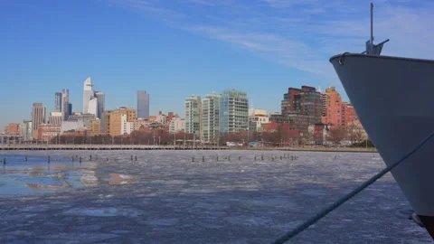 Hudson Yards skyscraper stands beyond frozen Hudson River in New York City. Video stock 300796635