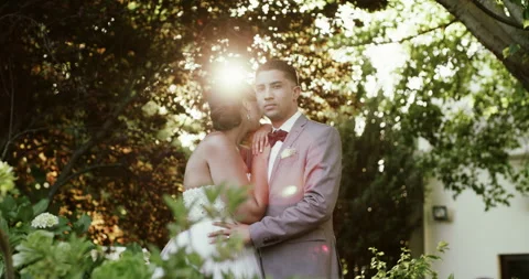 Hug, face or couple in wedding in nature for event celebration, commitment or 動画素材 258563964
