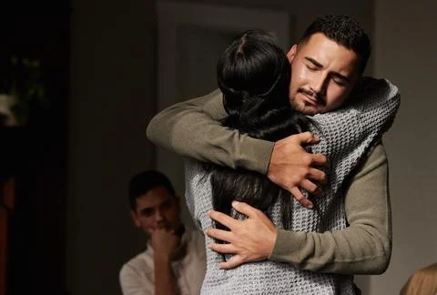 Hug, support and crying man embrace for comfort, grief and care after bad news Stock Photos